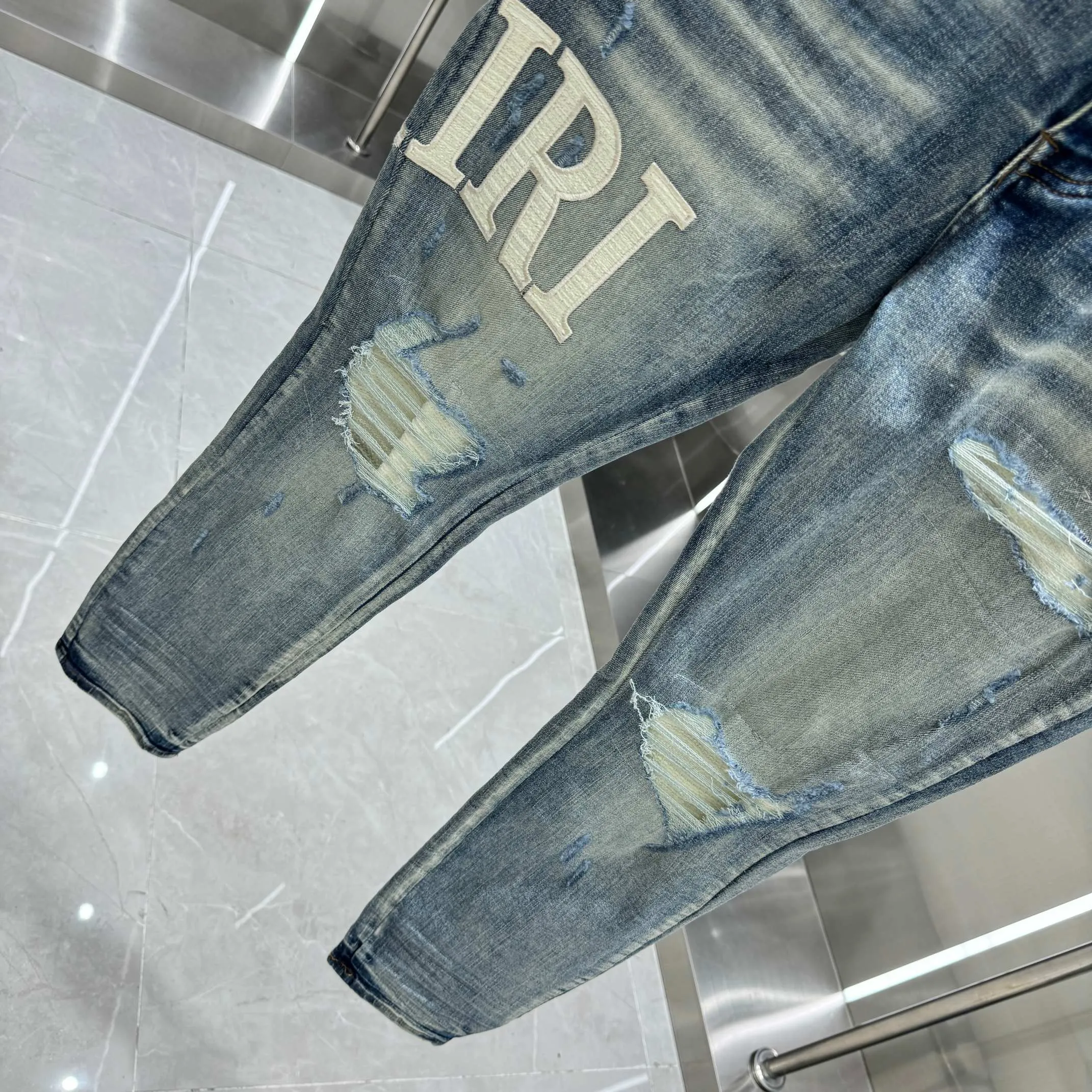 P290 Amiri ripped leather letter embroidery craft street fashion slim fit stretch jeans color blue size 30 32 34 36 38