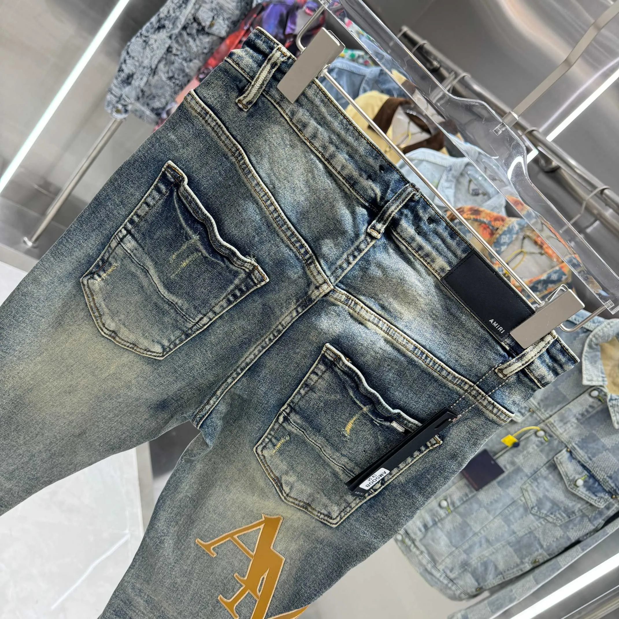 P290 Amiri ripped letter embroidery craft street fashion slim fit stretch jeans color blue size 30 32 34 36 38