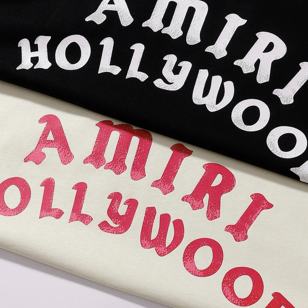 Style number: 749 P114 Fabric: 260g double yarn AMIRI 2025 spring and summer new logo round neck T-shirt high street men and women loose classic letter printed short sleeves Color: black. Apricot Size: S M L XL