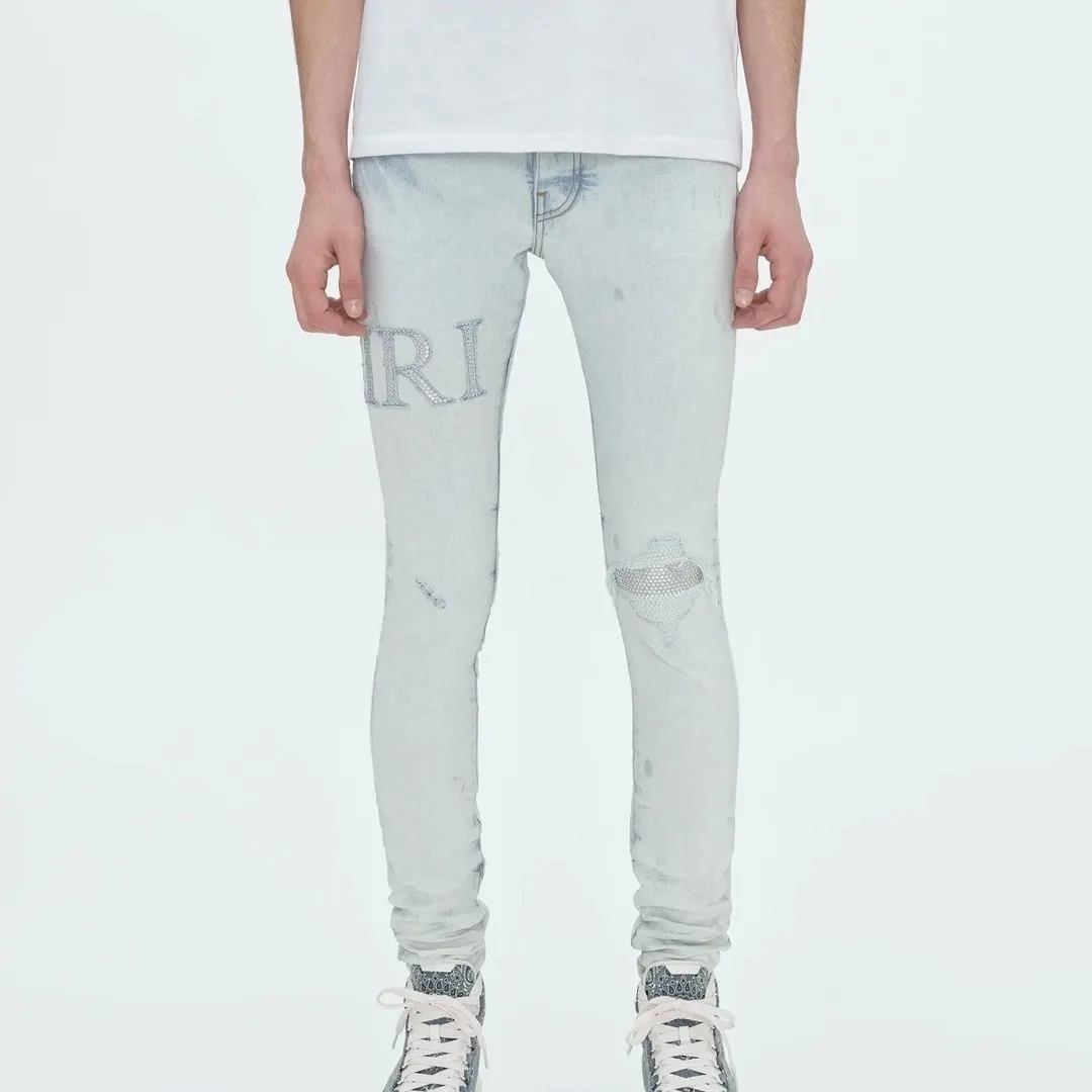 P156 model number Cc818 AMIRI white ripped high street jeans with diamonds! The transliteration of amiri is Emil, which is the name of the founder. Mike Amiri, the founder of amiri, grew up in Los Angeles, USA. He was influenced by local street culture and Punk Rock since he was a child, so he founded the amiri brand named after himself. A variety of trendy clothing meets the needs of different fashion players. Amiri clothing has novel and unique styles and is a well-known street brand in the United States. The styles and styles of many clothes are loved by many street photographers. The various clothing styles meet the dressing needs of different people, show their unique temperament, and show the trend of dressing. amiri's jeans are relatively famous. Not only do they have many styles, but the quality of their denim jackets is also very good. Many celebrities have also worn the amiri brand's denim series. The fabric is made of 100% cotton denim! High temperature setting, heavy sand washing, never fade, full of fashion! All made to order! -The colorful embroidery on the chest is so tense and the embroidery is neat! Imported machine for work! quality assurance!  -The entire garment is made with fine workmanship. Each seam is pressed using a double-needle machine. This stitching is a test of the workers' skills. If it goes astray, the entire garment will be scrapped. The hardware is custom-made, with exclusive logos, and is a one-to-one replica of the original! Original trademark! The fit is loose and slimming! Color: Picture color Size: m-2xl