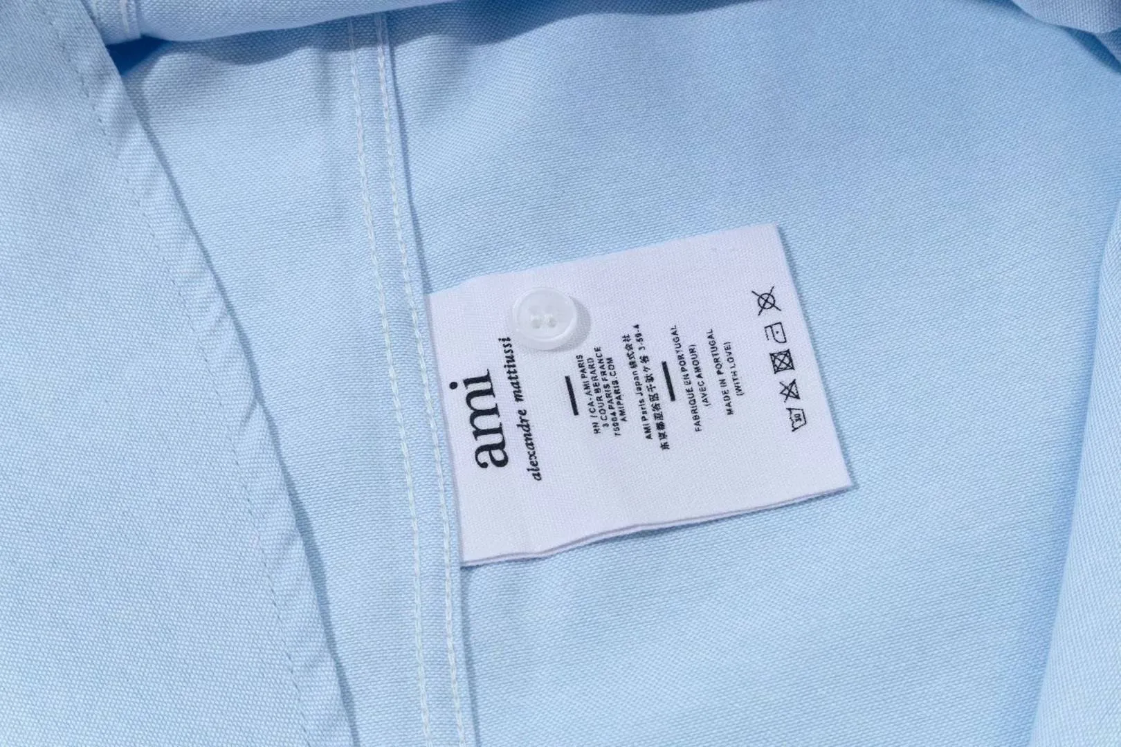 2219# AMI Paris 2025 Autumn and Winter Black classic small love embroidery on the chest Casual cotton solid color long-sleeved Oxford shirt Original custom-made 180g pure cotton fabric Regular version Same style for men and women Color: White Blue Size: S-XL
