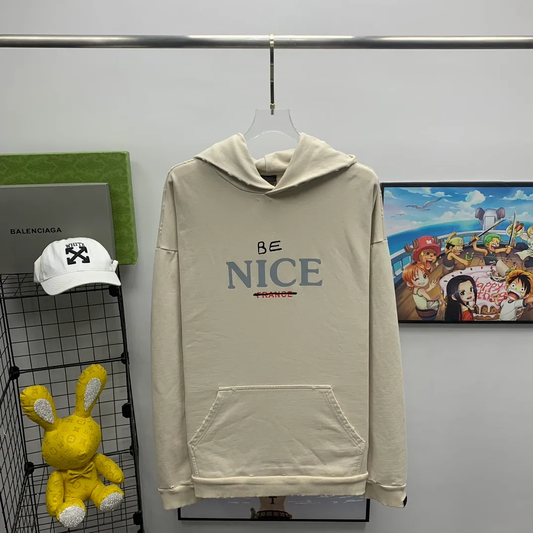 The top tested version weighs 520 grams 23FW Balenciaga BALENCIAGA NICE letters are aged and washed, loose and heavy, breaking the same style of male and female couple celebrities' pure cotton hooded sweatshirts. It will definitely attract attention when going out with couples style! Fashionable, relaxed and stylish, the atmosphere is instantly full! NICE printed letters have a very good meaning! The whole body adopts multiple destruction techniques, and it will definitely follow the pattern! Live broadcast artifact! The correct version has custom-woven embroidered auxiliary labels on the cuffs, which are double-sided. BALENCIAGA LOGO shows high-end temperament! Made of heavyweight 520g pure cotton fabric, 100% identical to the original! Custom woven and dyed, soft and comfortable, delicate and waxy to the touch, very comfortable on the upper body! The simple and fashionable round neck design is simple and extraordinary, and it is very eye-catching. The stitching is very smooth and delicate, with a certain degree of looseness. It is strong, stylish, washable, durable and will not deform easily after long-term wear!  Size: XS-L Color: Dark Blue Apricot P:390