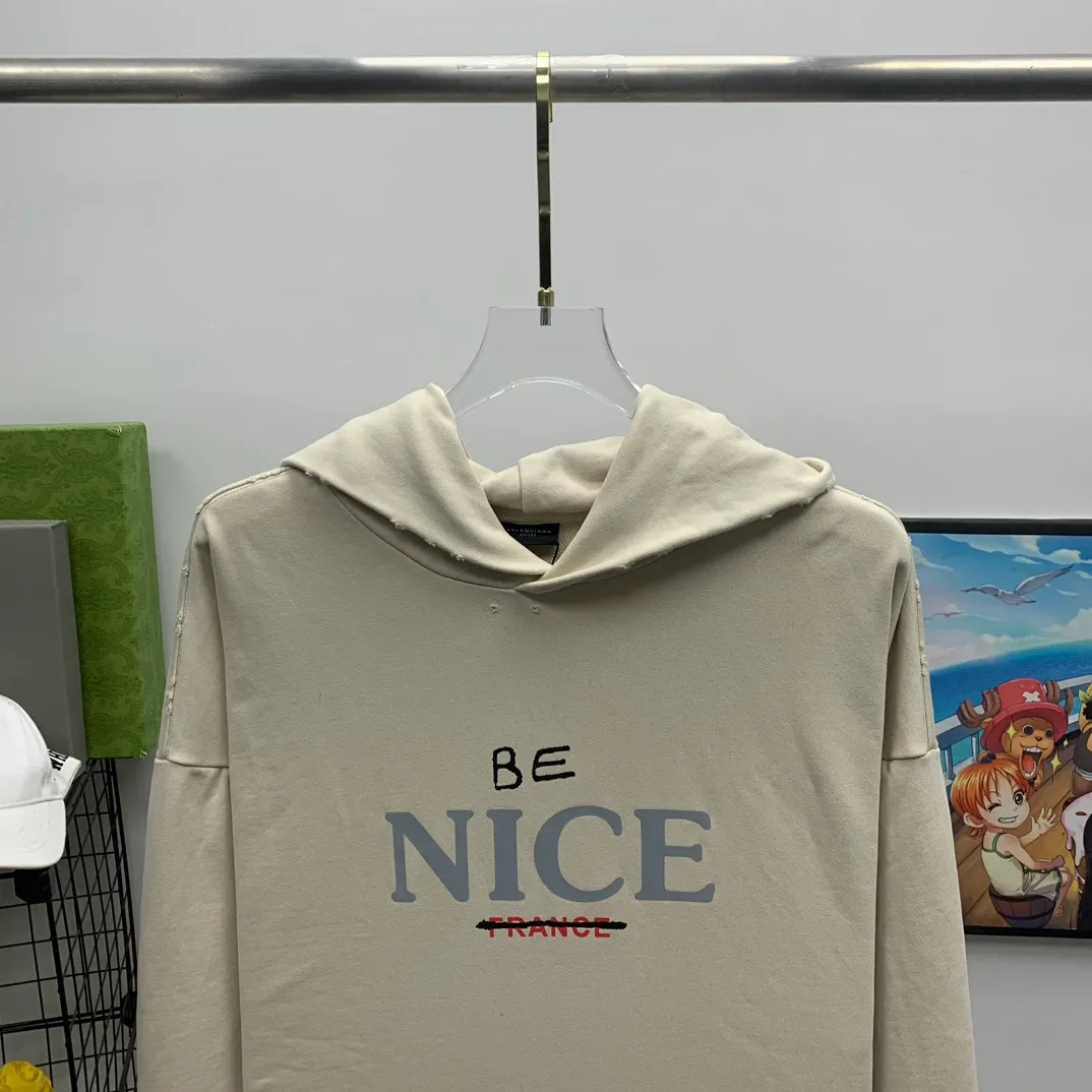 The top tested version weighs 520 grams 23FW Balenciaga BALENCIAGA NICE letters are aged and washed, loose and heavy, breaking the same style of male and female couple celebrities' pure cotton hooded sweatshirts. It will definitely attract attention when going out with couples style! Fashionable, relaxed and stylish, the atmosphere is instantly full! NICE printed letters have a very good meaning! The whole body adopts multiple destruction techniques, and it will definitely follow the pattern! Live broadcast artifact! The correct version has custom-woven embroidered auxiliary labels on the cuffs, which are double-sided. BALENCIAGA LOGO shows high-end temperament! Made of heavyweight 520g pure cotton fabric, 100% identical to the original! Custom woven and dyed, soft and comfortable, delicate and waxy to the touch, very comfortable on the upper body! The simple and fashionable round neck design is simple and extraordinary, and it is very eye-catching. The stitching is very smooth and delicate, with a certain degree of looseness. It is strong, stylish, washable, durable and will not deform easily after long-term wear!  Size: XS-L Color: Dark Blue Apricot P:390