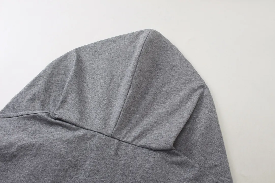 🅿️260 real photos [Top version. Official website quality] BALENCI*GA/Paris #2024 new style fake two-piece hooded embroidered short-sleeved T-shirt #2024 spring and summer brick cabinet synchronization. Welcome to compare. Hooded and sleeved. Super fashionable. The fabric is made of Paris ZP custom-woven and dyed cotton double yarn. The weight is 260 grams. The cloth surface is clean. The cloth pattern is clear, soft and comfortable. The threads are dyed with no color difference. The classic LOGO is embroidered with imported Tajima embroidery machine. The letters are clear and the effect is three-dimensional. Ready-to-wear hand-painted graffiti distressed. Extra heavy craftsmanship. Restore the brick cabinet, adopt the OS loose shoulder style. Same style for men and women. Code: BL225051 Color: black, floral gray Size: XS S M L
