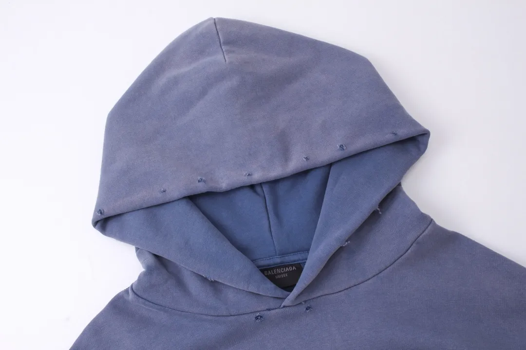 🅿️330 detailed pictures [Top version. Official website quality] BALENCI*GA/Paris BALENCI*GA#2024 latest model, classic letter LOGO graffiti. Toothbrush embroidery ready-to-wear distressed hooded sweatshirt. Brick cabinet synchronization. Genuine products are developed and developed in the first time. Welcome to compare! The fabric is made of Paris ZP custom-woven and dyed cotton sweatshirt. The weight is 450 grams. The cloth surface is clean. The cloth pattern is clear. It is soft and comfortable. It has good color fastness and is not easy to change color. The threads are woven and dyed with no color difference. The embroidery is done using imported Tajima embroidery machines. Over 10W needlework and extremely complex craftsmanship. The effect is three-dimensional and the lines are clear. No rough edges and lines. Ultra-high-tech embroidery. The hand-painted worn-out effect of ready-made garments. The version adopts OS loose shoulder design. Same style for men and women. Code: BL238030 Color: Dark blue gray. Floral gray. Washed blue Size: XS S M L