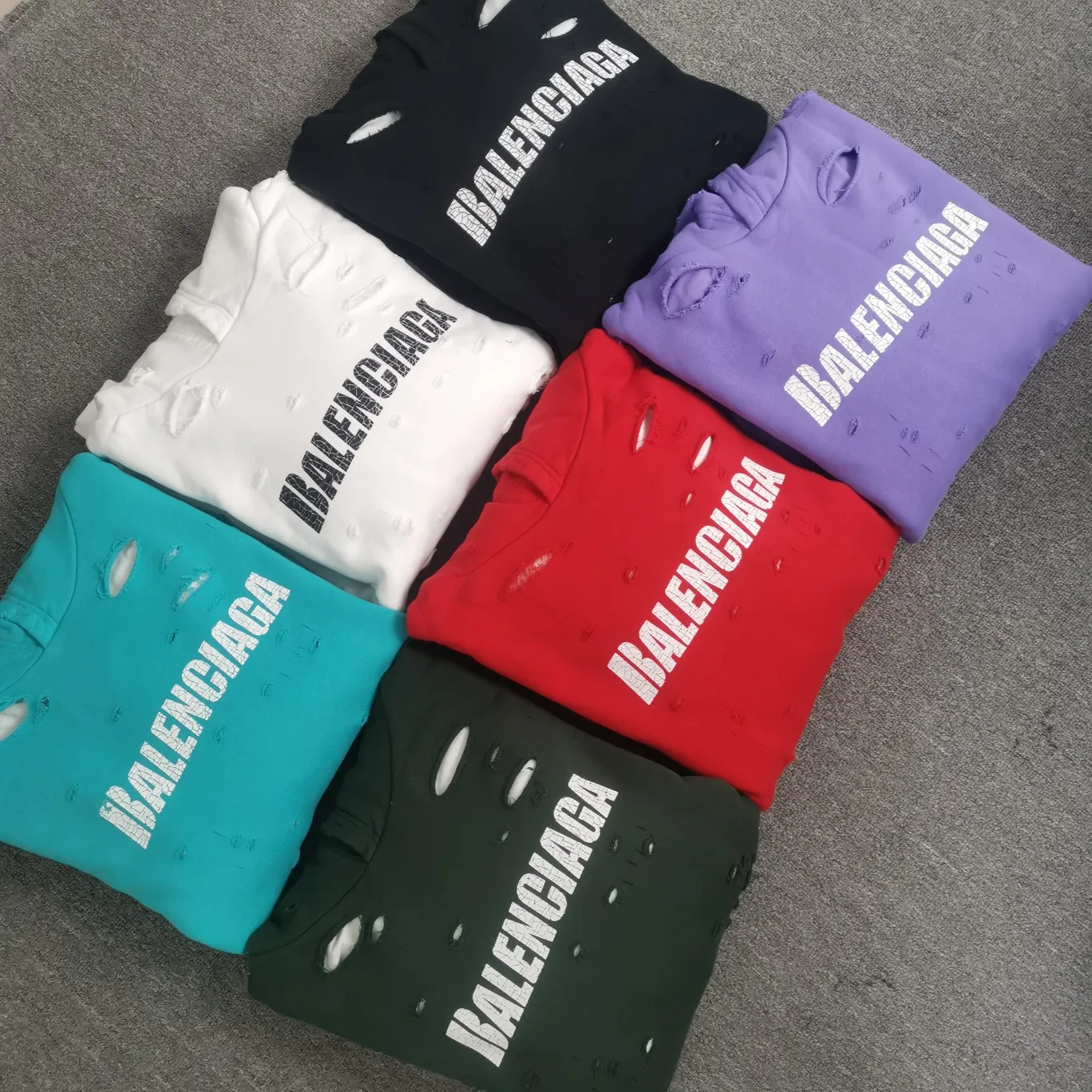 The top tested version of BALENCIAGA's Basic Cracked Sweatshirts and Hoodies for Male and Female Couples Stars can be said to be the most popular item among all the popular items. It has become popular on major self-media e-commerce platforms such as Xiaohongshu and Dewu. Heavy industrial craftsmanship tests the skills of lathes and printing techniques. Huge cost! Fabric: The outer fabric is made of 460g pure cotton fish scale terry fabric + the inner liner is 260g combed cotton. The weight of the ready-made garment exceeds 1kg, which can ❗️100%❗️ restore the drape of zp. The cost of fabric is over one hundred yuan. Washing process: After making the garment, the holes are polished by hand, and then washed to make it look old. The process is extremely complicated! There are more than 200 holes in the entire dress. The collar, cuffs, and hem are torn by hand (with pliers) rather than frayed. This is a more important detail.  Thread: dyed in the same vat with no color difference. Printing: made of special cracked material to achieve the ultimate in breathability and aesthetics! Just like the patterns on a turtle’s back, each one is different!  Accessories: Complete set of customized accessories + Sydney paper Size: XS-L (maximum wear: 230 catties) Color: blue black white purple red cyan P: 570