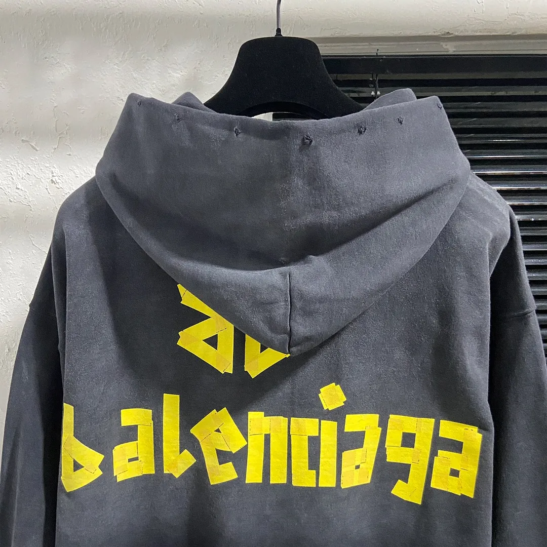 🅿️330 7153# Actual pictures Top version [BALENCIA*GA] Official website quality Paris's new yellow tape series hooded sweatshirt OS version Loose dropped shoulders Unisex style Fabric: 480g 100% cotton terry sweatshirt Technology: Front and back digital direct printing Garment wash Worn Old Shape Solid color Color: Washed black Gray blue Washed blue Size: XS S M L
