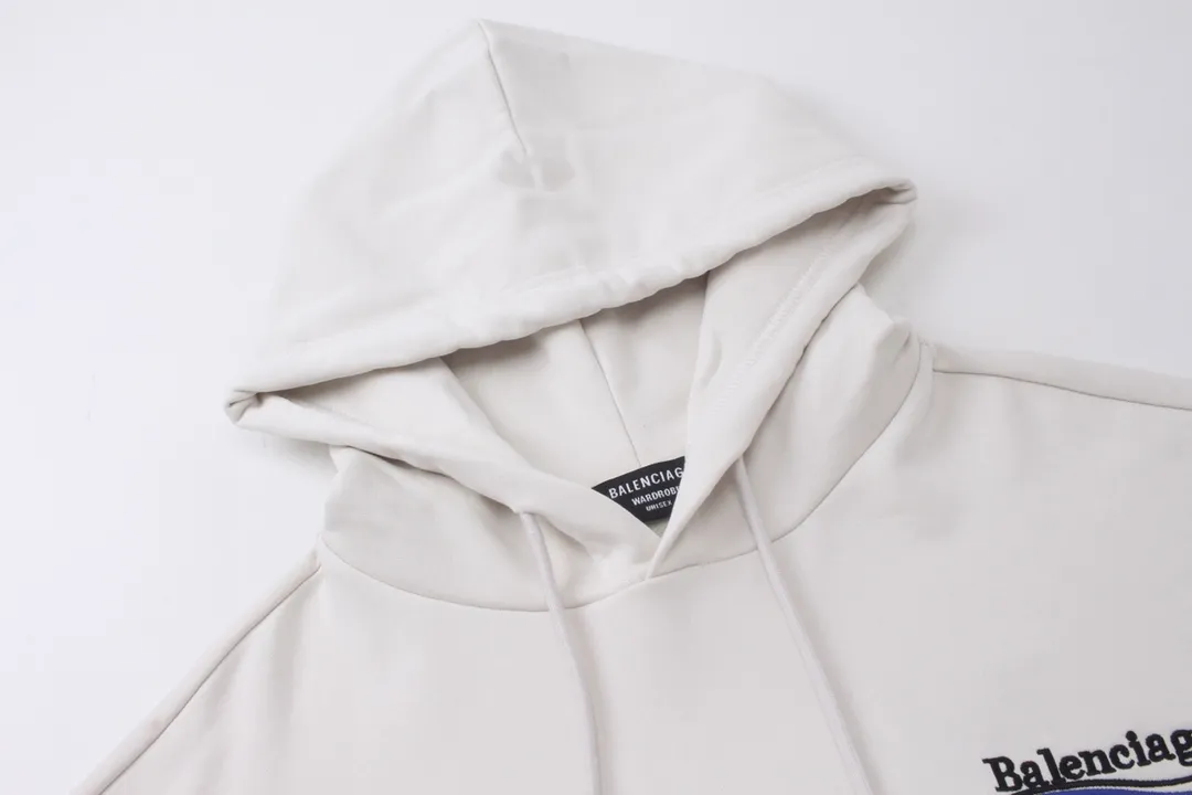 🅿️296 Detailed picture [Top version. Official website quality] BALENCI*GA/Paris. Classic style, #COLA Embroidered Hooded Long-Sleeve Sweatshirt# The fabric is made of Paris ZP custom-woven and dyed cotton terry sweatshirt, with a weight of 450 grams. The cloth surface is clean. The cloth pattern is clear, soft and comfortable. The threads are dyed with no color difference. The classic letter LOGO pattern is embroidered with an imported Tajima embroidery machine. The letters are clear and have a strong three-dimensional effect. Restored brick cabinets. Welcome to compare. The version adopts OS loose shoulder version. Same style for men and women. Code: BL238035 Color: black, white, cement white, dark gray Size: XS S M L