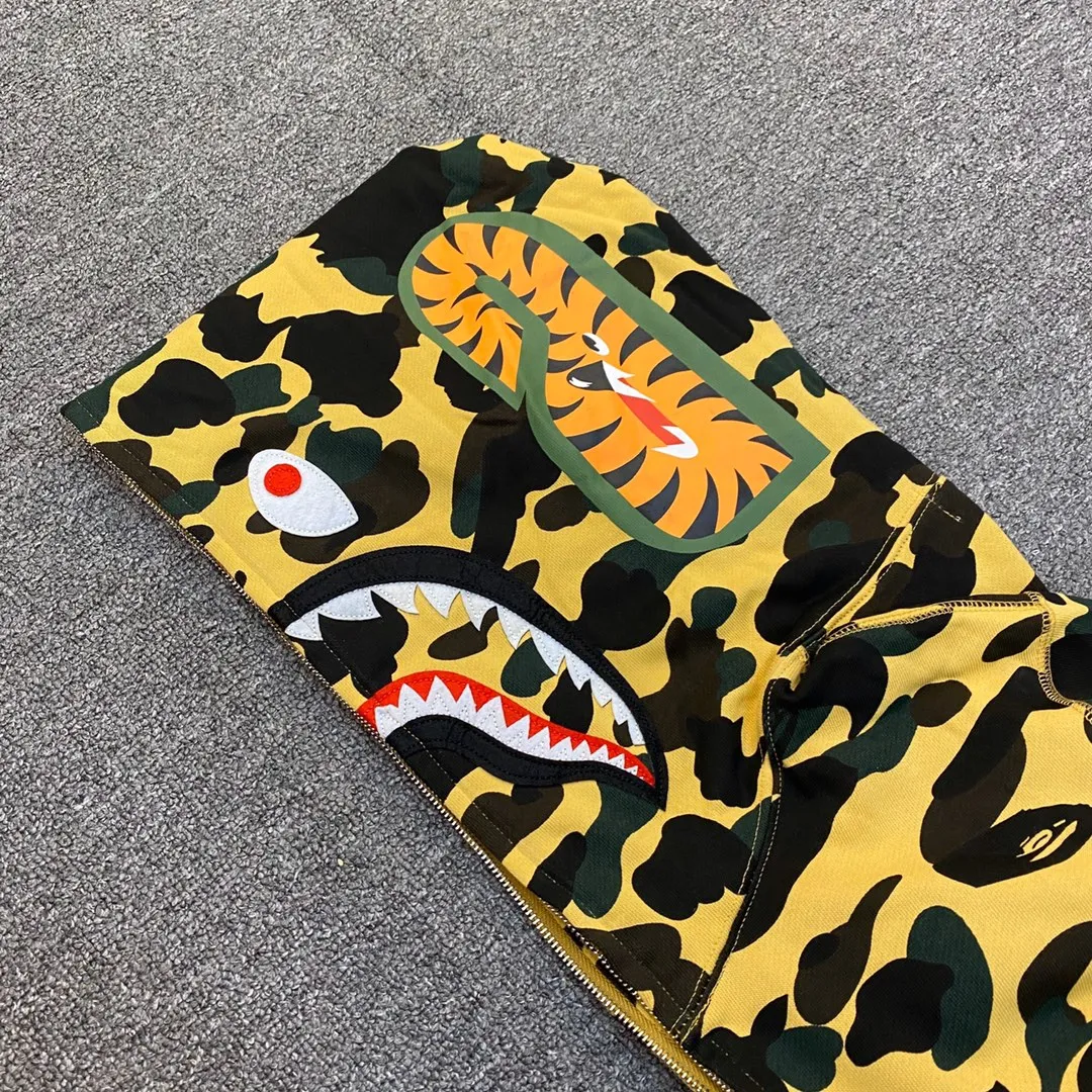 💰380 BAPE 1ST CAMO SHARK FULL Classic counter model Camouflage shark hooded zipper sweatshirt Machine-printed camouflage Top-quality fabric High-end 1:1 replica Customized fabric Couple model: S—XXL [Camouflage yellow, Camouflage green, Camouflage red, Camouflage purple, Camouflage blue, Camouflage gray]