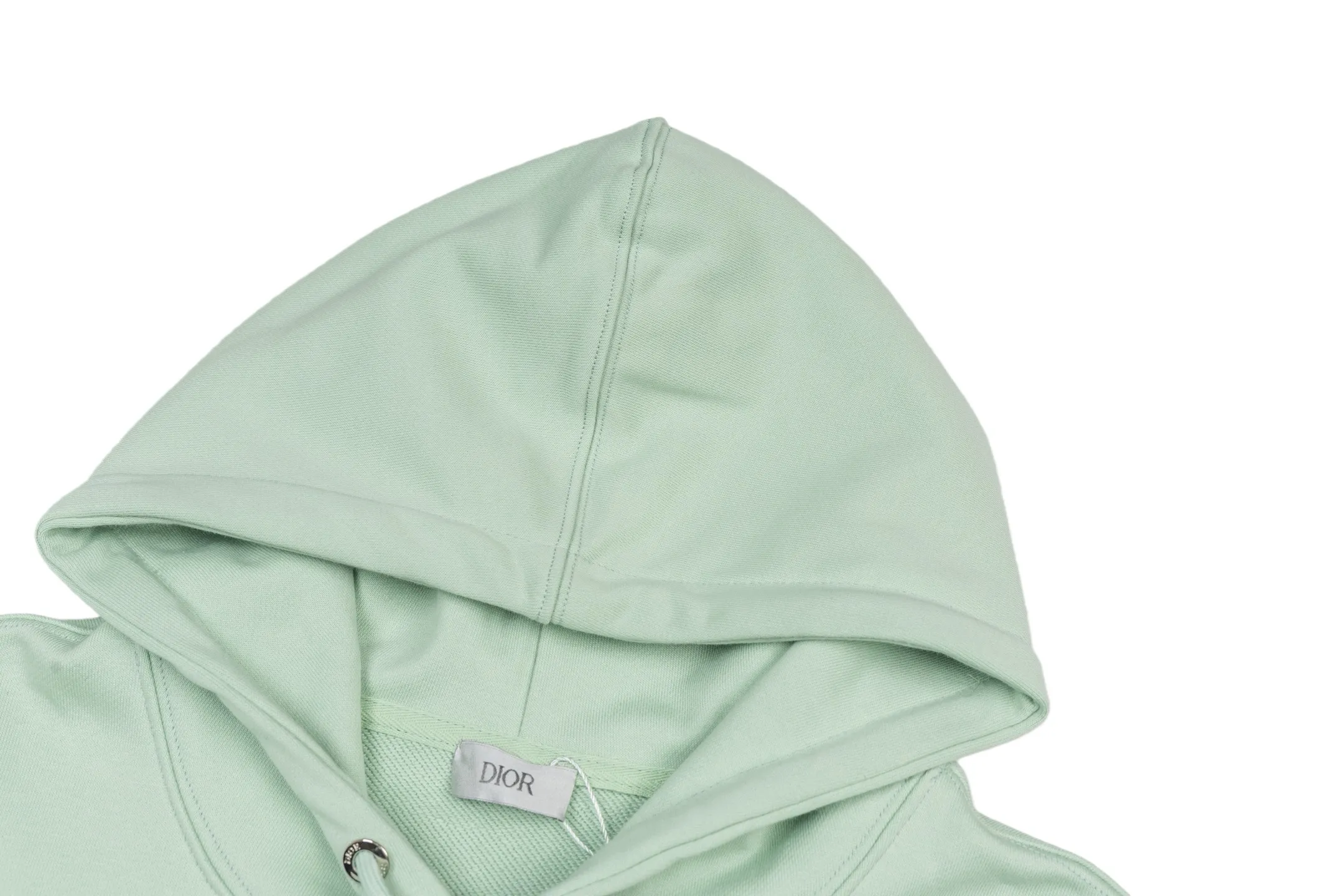 🅿️360 CD logo embroidered hooded sweatshirt (green) The original version was purchased and developed for 9,078. The fabric is made of high-quality green cotton fleece fabric, which is soft and comfortable to the touch. The delicate tonal CD Icon embroidery on the chest is low-key and elegant, highlighting the brand details. The drawstring hood design is paired with metal accessories engraved with the Dior logo to enhance the overall texture. The practical kangaroo pocket on the front is as beautiful as it is practical. Ribbed cuffs and hem ensure comfort while maintaining a structured silhouette. 100% cotton material brings excellent breathability and skin-friendly experience. The regular fit has a neat cut and is easy to match with a variety of bottoms. Exquisite embroidery technology and delicate fabric processing complement each other, reflecting Dior's consistent meticulous workmanship. This sweatshirt is the perfect blend of athleisure and haute couture, making it ideal for everyday style. Size:S-M-L-XL
