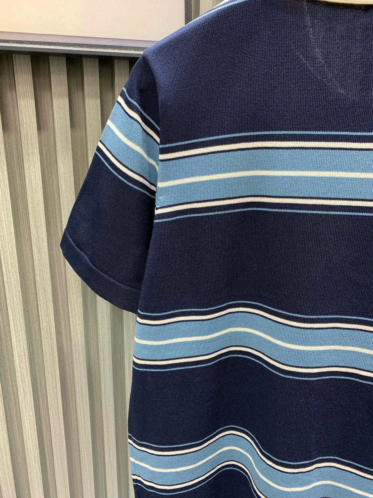 🅿️330 🀄️ DIOR Dio* 25ss new embroidered lily of the valley lapel striped knitted short-sleeved POLO. Made of custom imported wool knitted material. The fabric is soft and comfortable, skin-friendly and breathable. The chest pocket is decorated with exquisite lily of the valley flower embroidery. Brand logo and slogan logo. Cuff stripe design. Can be matched with many types of clothing to create a fashionable look. Customized accessories. Complete three labels. Same style for men and women.