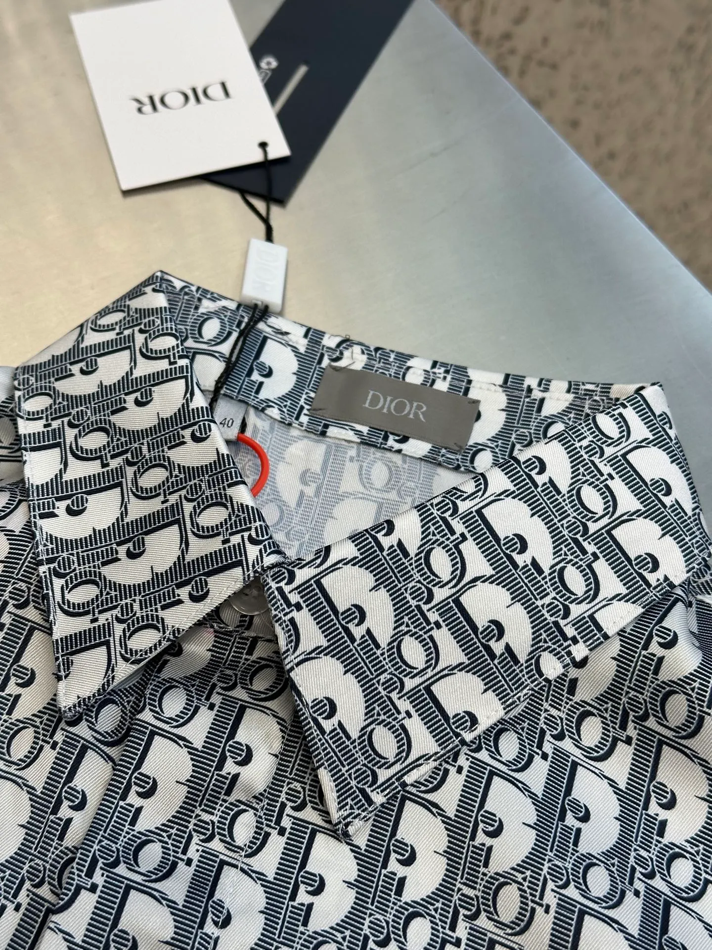 🅿️470 Dior Oblique all-over printed shirt. Customized polyester premium shirt material. The whole body is decorated with the same color Oblique print and integrated with the shirt, highlighting the noble temperament of the brand.  Digital printing technology uses digital pattern design and prints the pattern directly on the fabric through an inkjet printer to achieve full Dior Oblique printing.  The ironing position uses a high-temperature ironing machine. Through the synergistic effect of the heating plate and the pressure roller, high temperature and pressure are applied to the fabric to make the surface of the fabric smooth, crisp, wear-resistant and washable.  size: 39.40.41.42