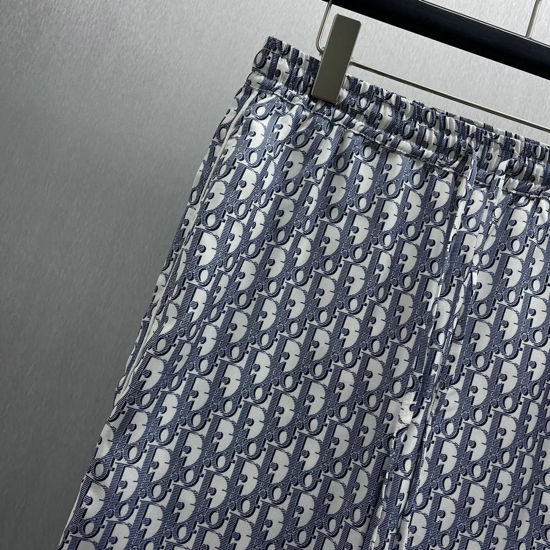 🅿️430 🧧CD Allover Printed Presbyopic Pajama Pants Size: S-XL These pajamas feature the brand’s classic Oblique print all over. Crafted from white and blue mulberry silk twill, it features an elasticated drawstring waistband, side slit pockets and rear welt pockets.