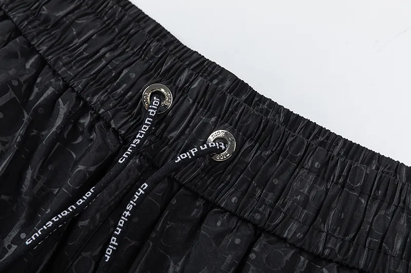 🅿️210 DiOr Dior 2025 Spring and Summer Logo printed all over. New fashionable beach shorts, with lining and mesh shorts! The official website is synchronized with the original 1-1 replica, the original hardware is selected from high-quality polyester fiber fabrics, with a delicate feel, a must-have item for summer, and the upper body effect is super handsome! Color: Black Size: S M L XL XXL