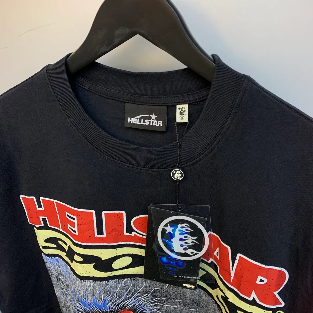 P134 Hellstar Knock-Out T-Shirt Custom Cut and sew garment manufactured in Los Angeles. Dyed and potassium sprayed with jumbo screen print. Fits slightly oversized. Gentle wash tumble dry. Dry clean preferred Newly popular and trendy Hellstar short-sleeved T-shirt!   Standard beauty and trendy workmanship, original customization (fabric, pattern, printing, hang tag, main mark, etc.), exaggerated style, explosive style, dare to break through tradition, bring adventurous new fashion experience!  YoungBoy, the most popular rapper in the youth circle, has shot a lot of models for him, and celebrities such as Dababy and Swae Lee frequently get dressed!  color: Vintage Black (washed black)