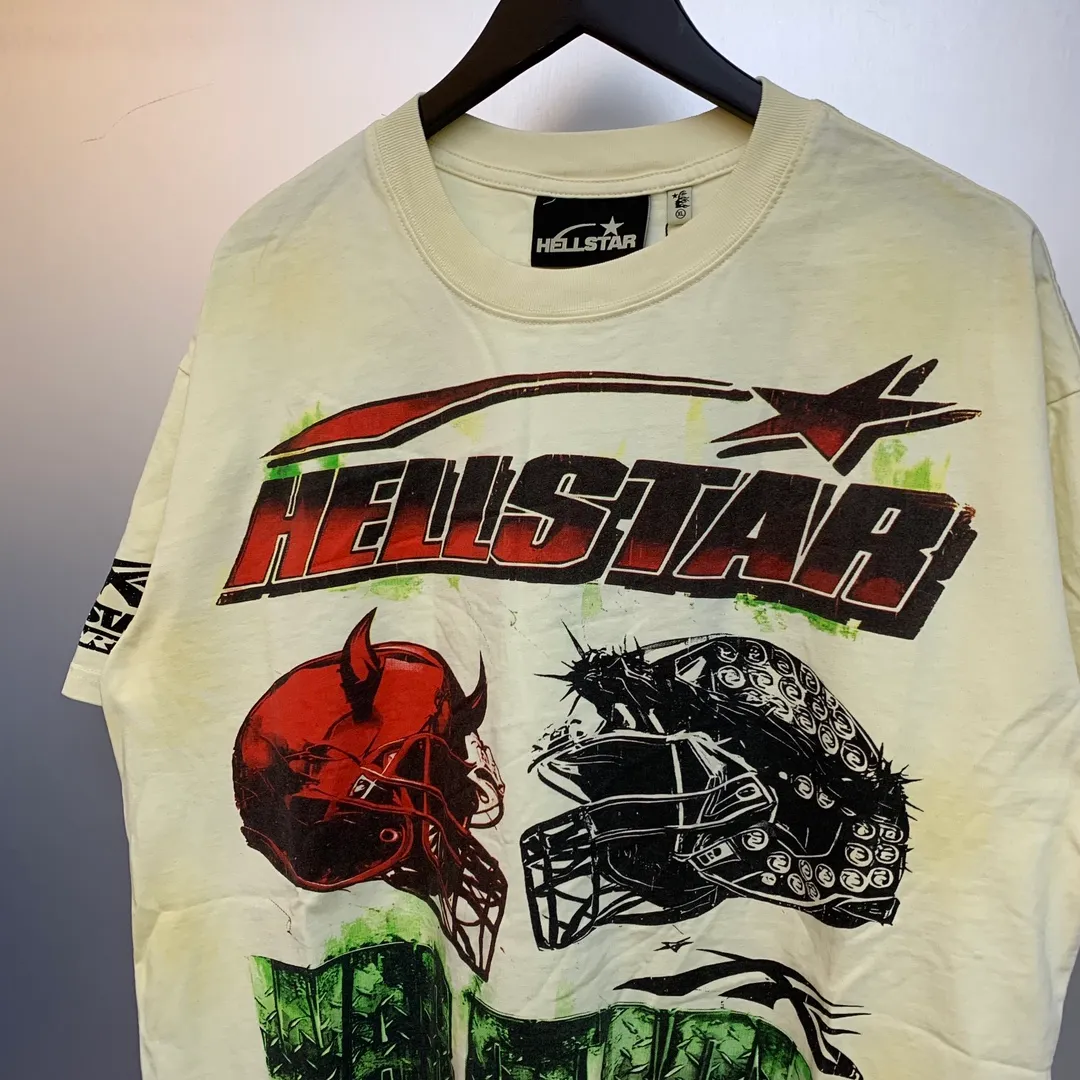 P134 Hellstar War Ready! T-Shirt Custom Cut and sew garment manufactured in Los Angeles. Dyed and potassium sprayed with jumbo screen print. Fits slightly oversized. Gentle wash tumble dry. Dry clean preferred New hot trendy Hellstar short-sleeved T-shirt!   Standard beauty and trendy workmanship, original customization (fabric, pattern, printing, hang tag, main mark, etc.), exaggerated style, explosive style, dare to break through tradition, bring adventurous new fashion experience!  YoungBoy, the most popular rapper in the youth circle, has shot a lot of models for him, and celebrities such as Dababy and Swae Lee frequently get dressed!   color: cream (beige) Size: S, M, L, XL