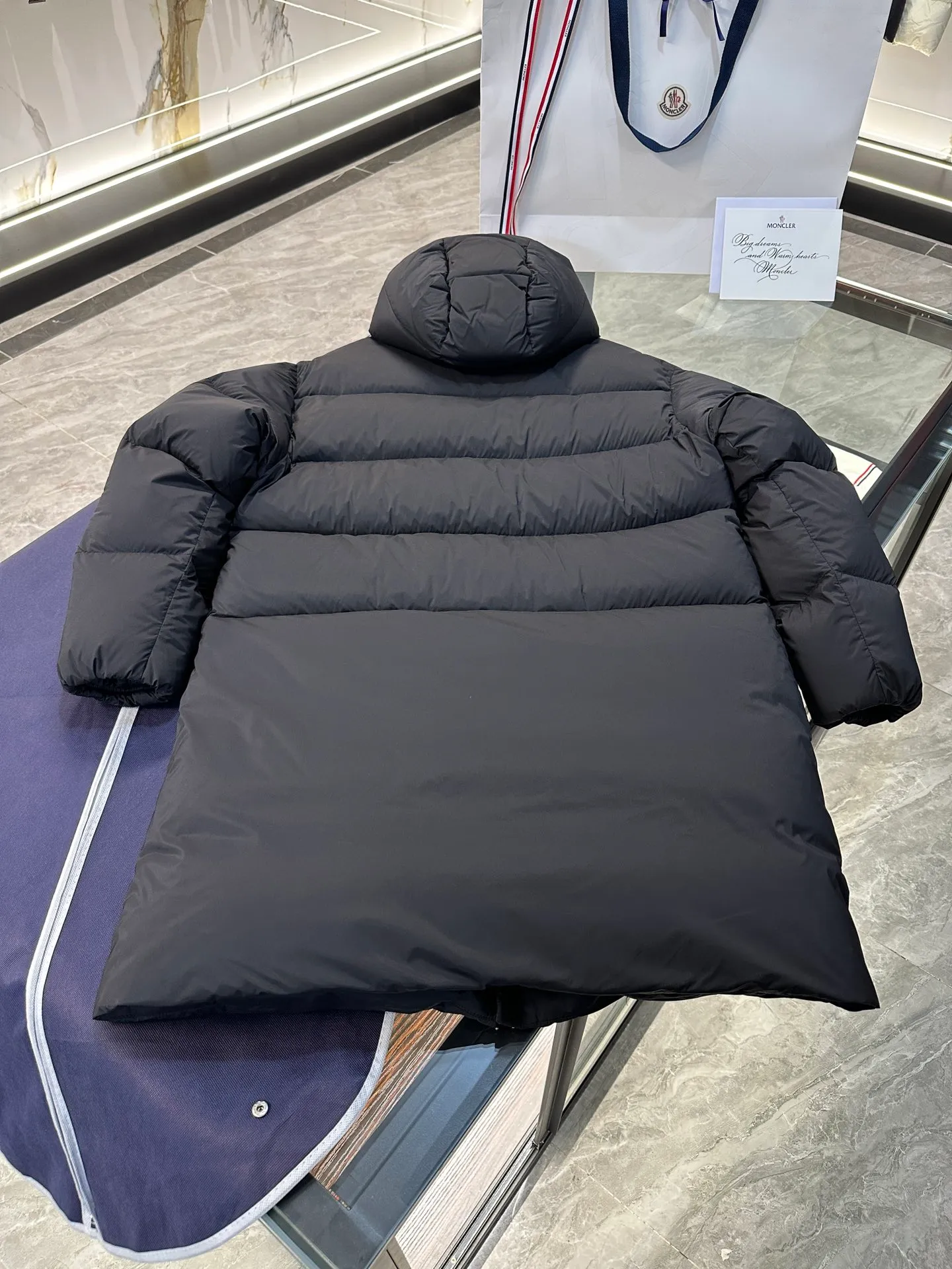 P1120 Moncler Bosona mid-length large felt badge down jacket. More details shot.