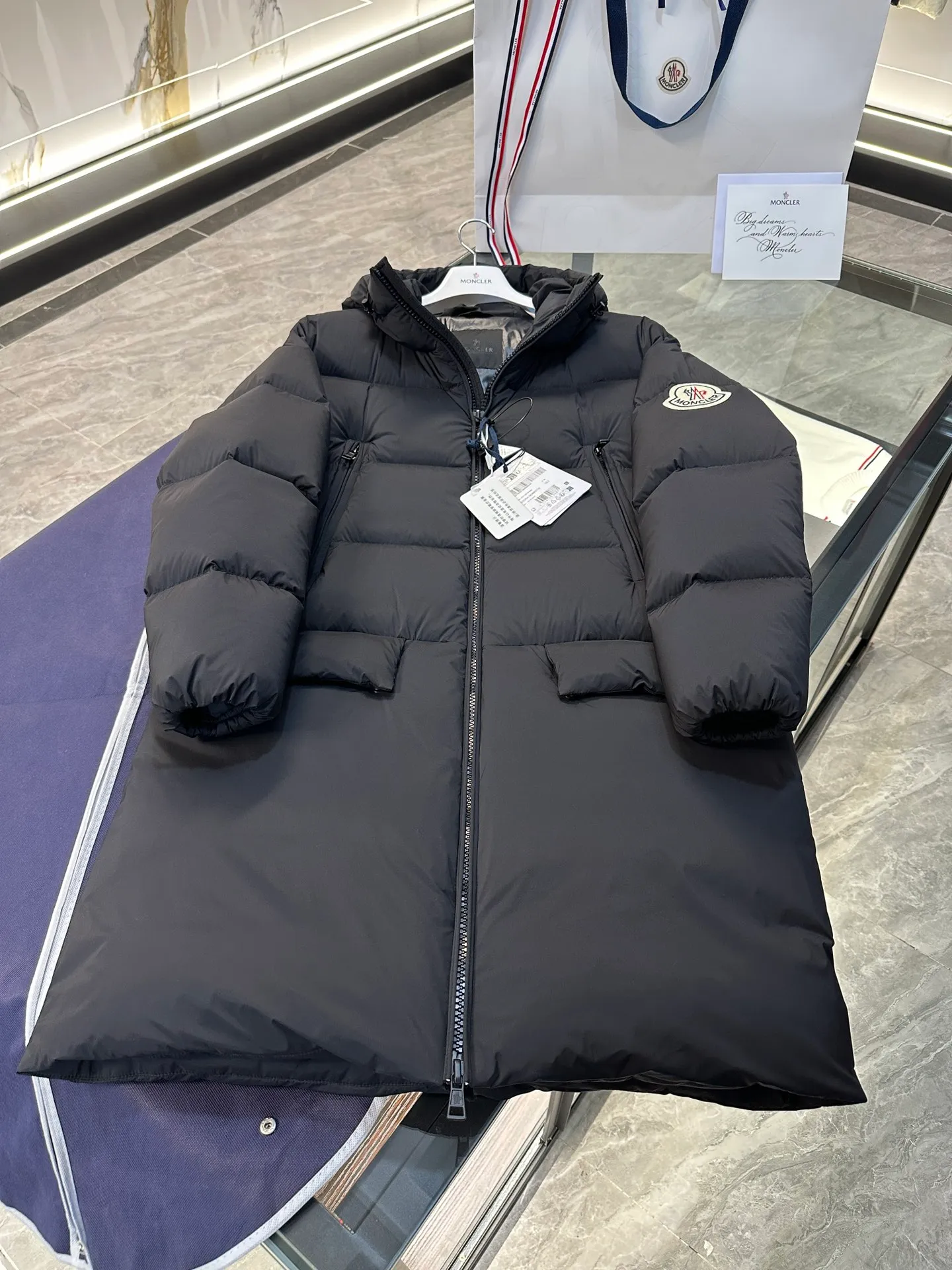 Moncler Bosona mid-length large felt badge down jacket. More details shot. P1100