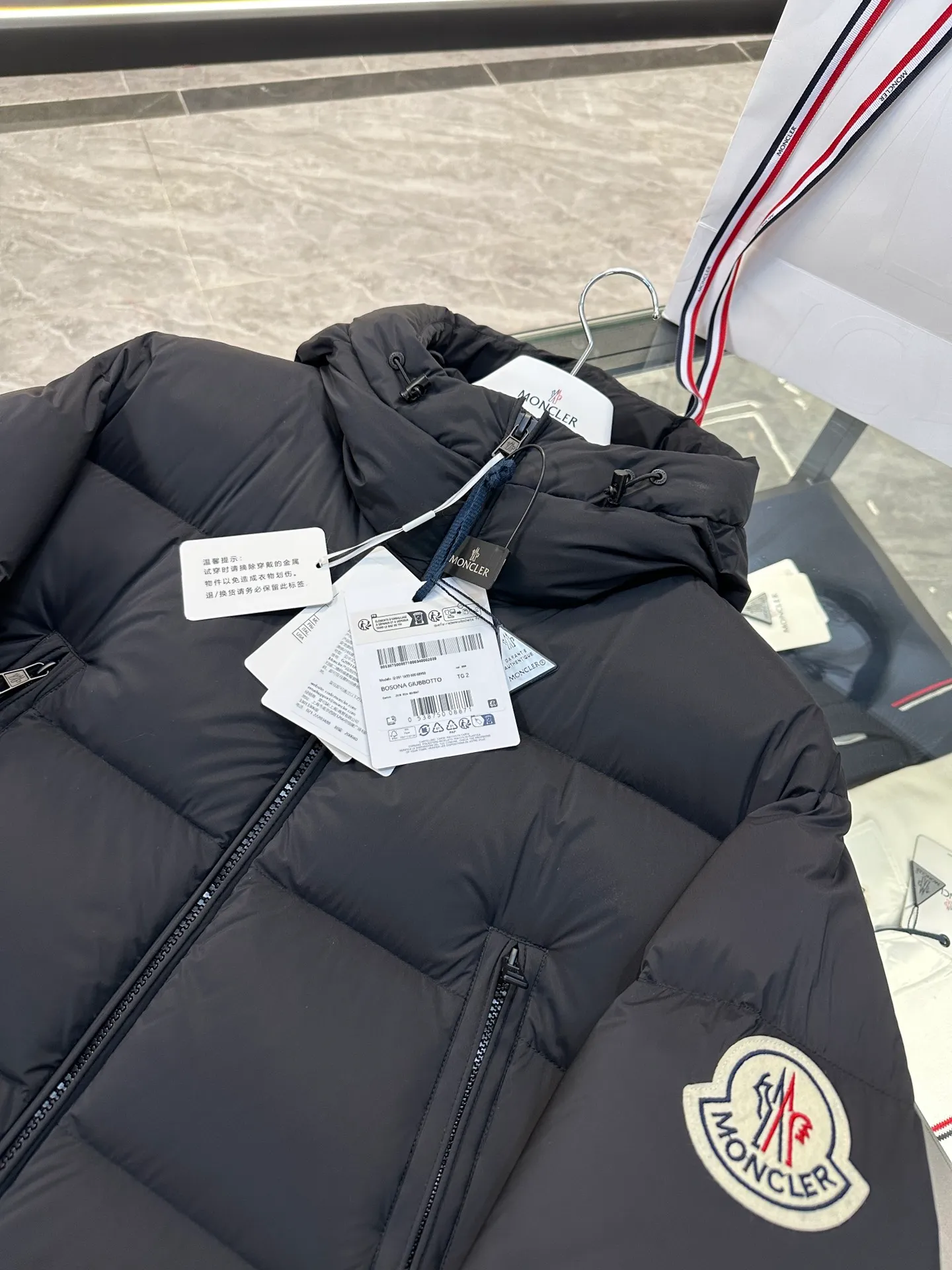 Moncler Bosona mid-length large felt badge down jacket. More details shot. P1100