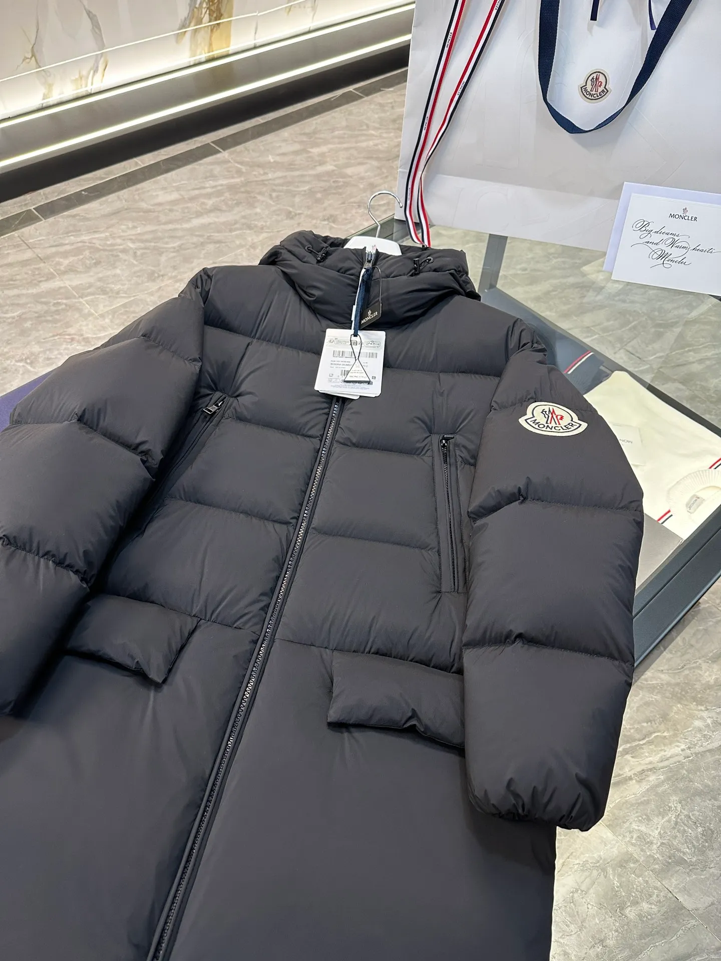 Moncler Bosona mid-length large felt badge down jacket. More details shot. P1100