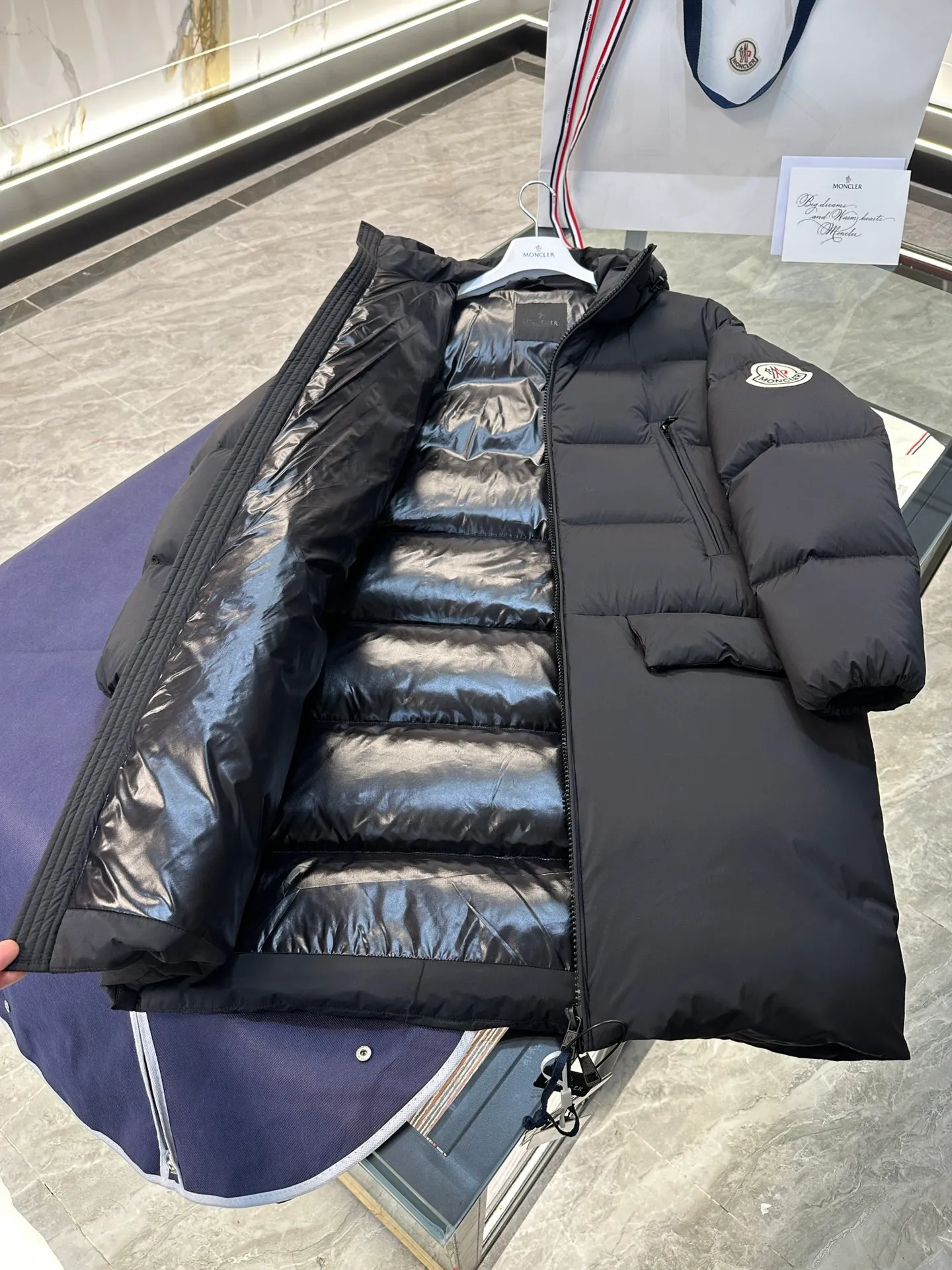 Moncler Bosona mid-length large felt badge down jacket. More details shot. P1100