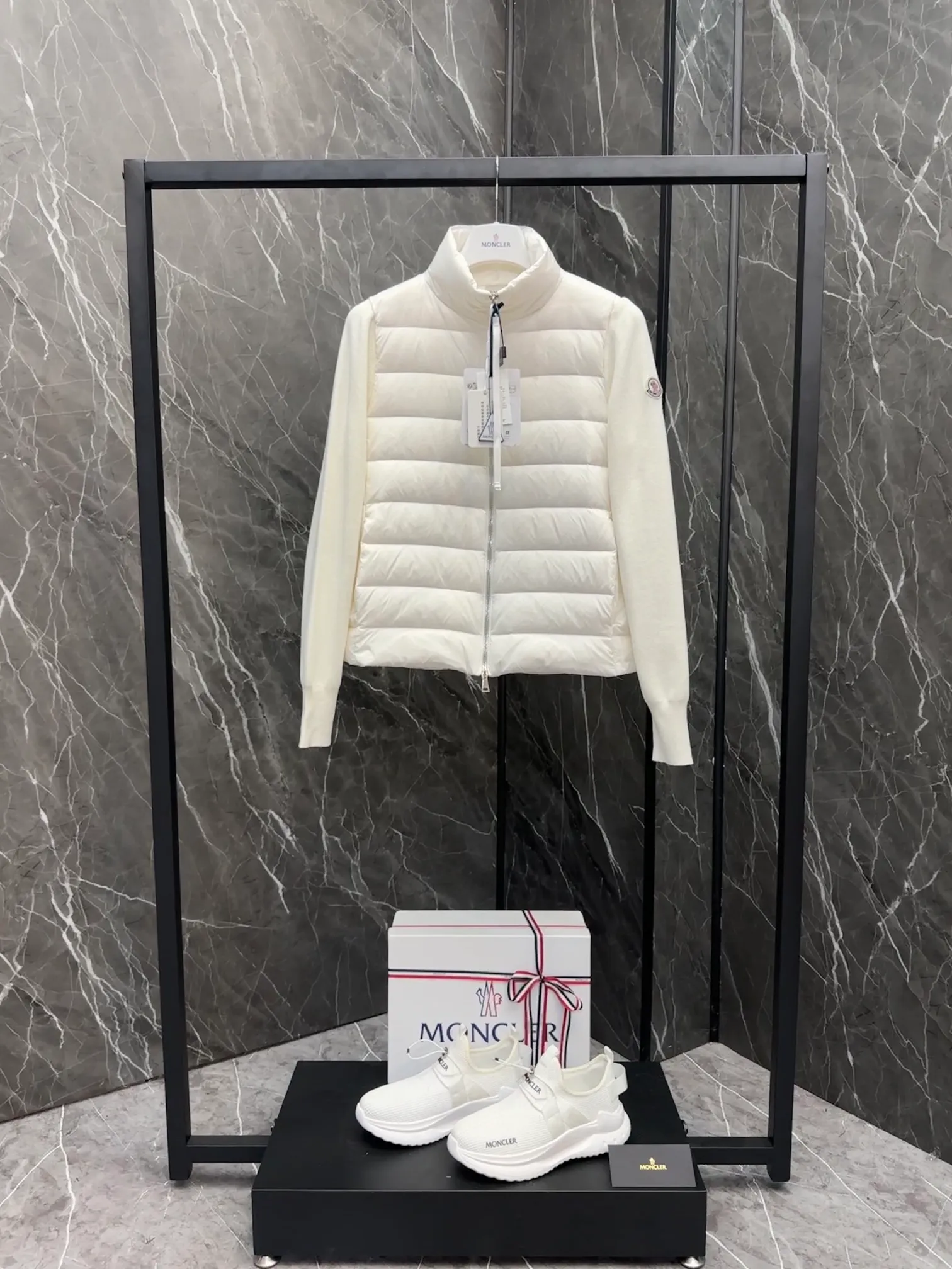 P660 New in Down⬆️Moncler Cardigan Women's Lightly Padded Wool Down Cardigan Jacket. This women's wool cardigan is filled with down and is suitable for all seasons.  This cardigan is a classic Moncler design that can be worn on its own when the weather is nice, or paired with jackets and coats when the weather cools down. Wool knit style with down-filled front for warmth and protection. Details Made of fine wool and nylon léger brillant •Nylon léger brillant lining •Down filling •Jersey knit •14 gauge •Zip closure •Zip pockets Size : 1-3 Black White