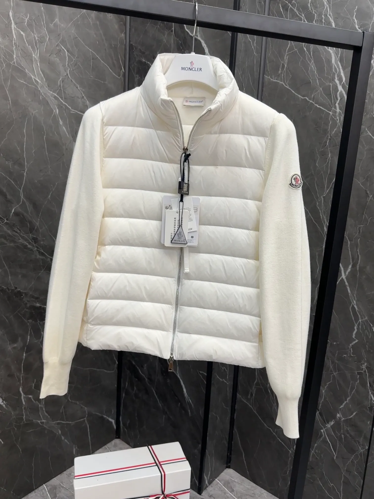 P660 New in Down⬆️Moncler Cardigan Women's Lightly Padded Wool Down Cardigan Jacket. This women's wool cardigan is filled with down and is suitable for all seasons.  This cardigan is a classic Moncler design that can be worn on its own when the weather is nice, or paired with jackets and coats when the weather cools down. Wool knit style with down-filled front for warmth and protection. Details Made of fine wool and nylon léger brillant •Nylon léger brillant lining •Down filling •Jersey knit •14 gauge •Zip closure •Zip pockets Size : 1-3 Black White