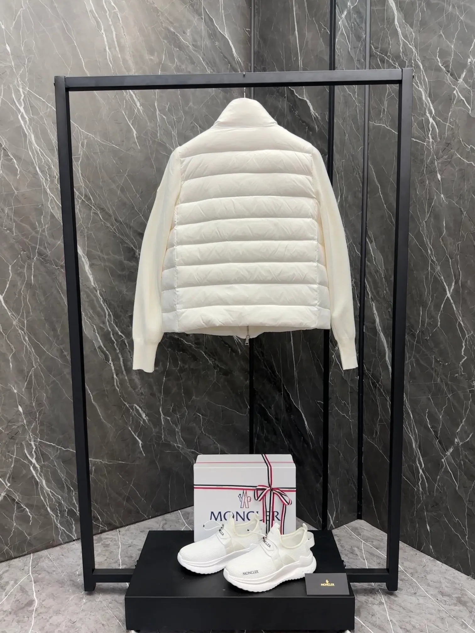 P660 New in Down⬆️Moncler Cardigan Women's Lightly Padded Wool Down Cardigan Jacket. This women's wool cardigan is filled with down and is suitable for all seasons.  This cardigan is a classic Moncler design that can be worn on its own when the weather is nice, or paired with jackets and coats when the weather cools down. Wool knit style with down-filled front for warmth and protection. Details Made of fine wool and nylon léger brillant •Nylon léger brillant lining •Down filling •Jersey knit •14 gauge •Zip closure •Zip pockets Size : 1-3 Black White