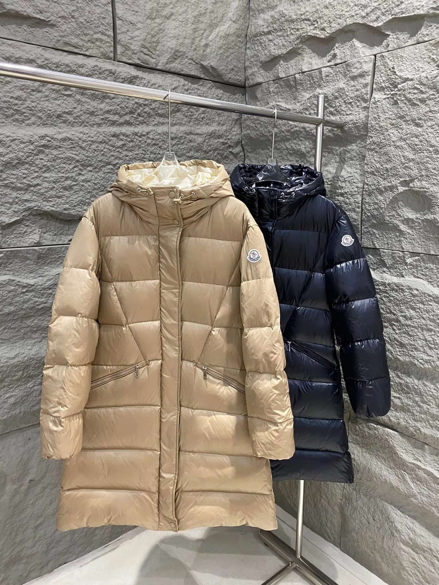 P1180 Moncler Bellevue Women's Long Belted Down Jacket The Bellevue down jacket is made of iconic nylon laqué fabric, interpreting classic Moncler style. Long design, the fabric has been functionally treated for a gorgeous lustrous effect. This hooded thermal piece has a feminine silhouette and an elastic waistband. From day to night, from the city to the mountains, it can be easily handled. Color: black/khaki Size: 0/1/2/3