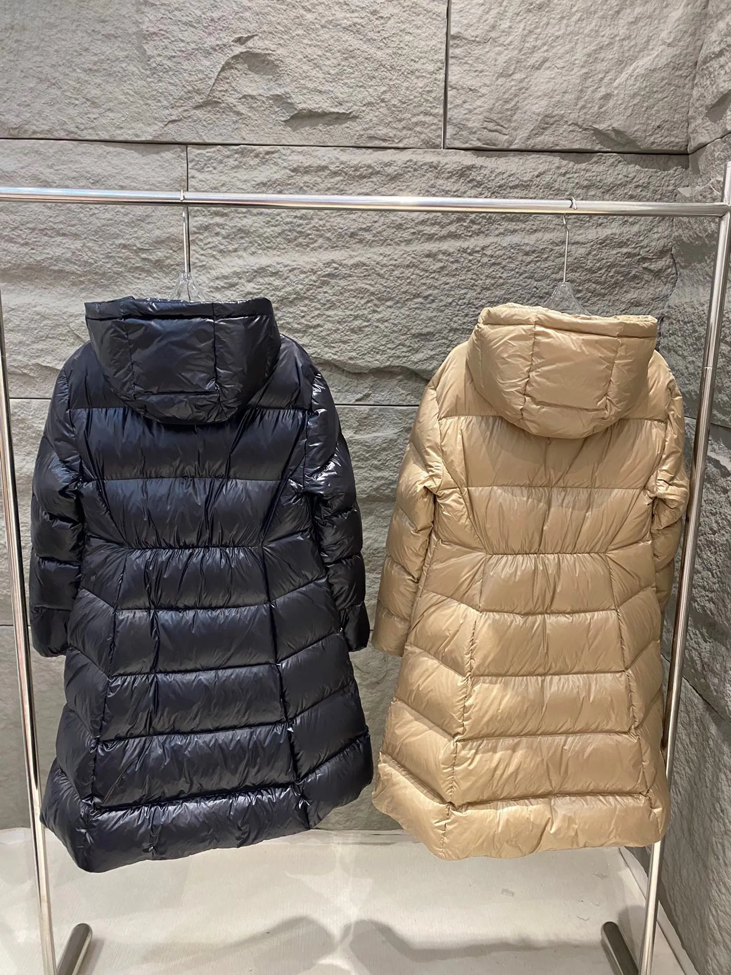 P1180 Moncler Bellevue Women's Long Belted Down Jacket The Bellevue down jacket is made of iconic nylon laqué fabric, interpreting classic Moncler style. Long design, the fabric has been functionally treated for a gorgeous lustrous effect. This hooded thermal piece has a feminine silhouette and an elastic waistband. From day to night, from the city to the mountains, it can be easily handled. Color: black/khaki Size: 0/1/2/3