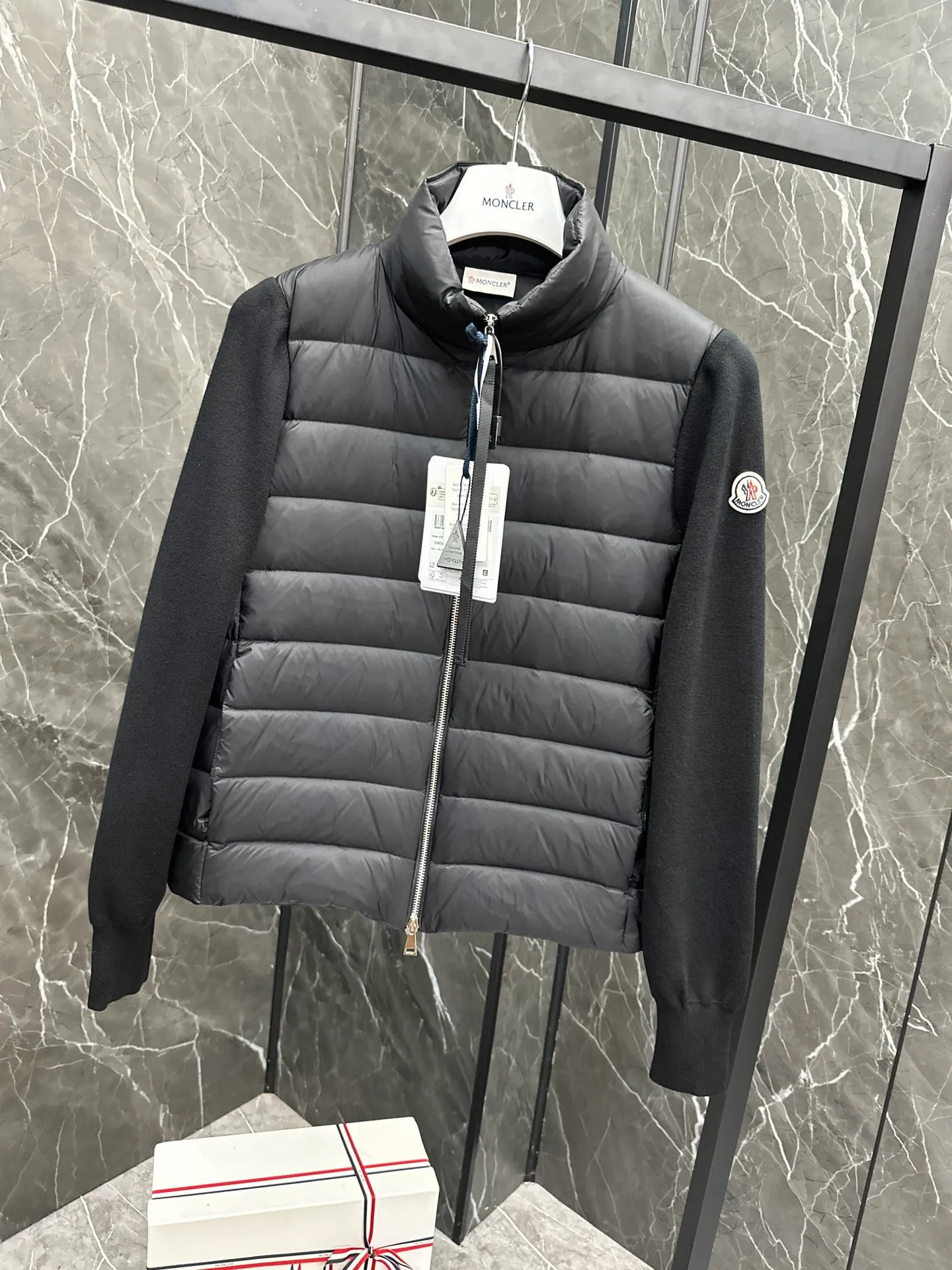 P660 New in Down⬆️Moncler Cardigan Women's Lightly Padded Wool Down Cardigan Jacket. This women's wool cardigan is filled with down and is suitable for all seasons.  This cardigan is a classic Moncler design that can be worn on its own when the weather is nice, or paired with jackets and coats when the weather cools down. Wool knit style with down-filled front for warmth and protection. Details Made of fine wool and nylon léger brillant •Nylon léger brillant lining •Down filling •Jersey knit •14 gauge •Zip closure •Zip pockets Size : 1-3 Black White