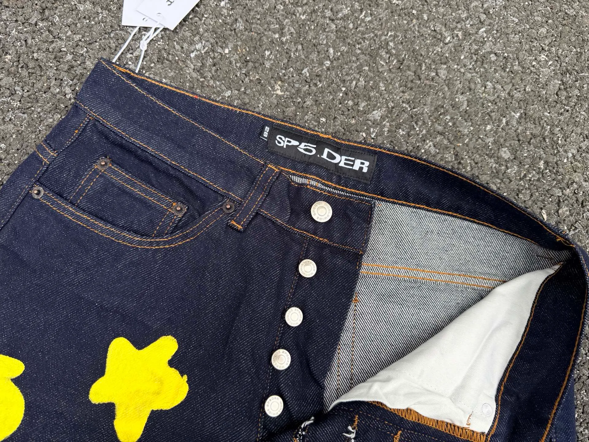 -Size details P250 (original outdoor picture direct) top version Sp10der street fashion brand foam printed big star washed and distressed casual jeans for men and women color: raw cow color code number: 28 30 32 34 36